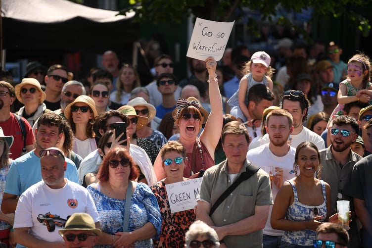 The 21st Watercress Festival took place in Alresford, Hampshire this weekend, with thousands of visitors taking to the streets of the town synonymous with producing the natural superfood, taking part in activity stalls, enjoying entertainers and musicians as well as take in the cooking expertise of professional chefs at the annual event.
Pictured: Supporters gather to egg on the 'athletes' in te Watercress eating competition..©Russell Sach - 0771 882 6138